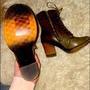 Beautiful dark green and brown rustic colored boots. Size 8 but runs small